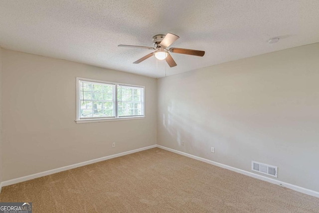 3661 Boring Rd, Decatur, GA 30034 - spare room featuring carpet, a ceiling fan, baseboards, and a textured ceiling