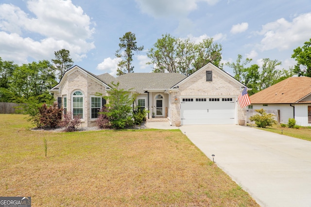 4043 Gramercy Dr, Valdosta, GA 31605 - view of front of house with an attached garage, concrete driveway, and brick siding
