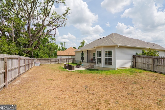 4043 Gramercy Dr, Valdosta, GA 31605 - back of property featuring a patio area and a shingled roof