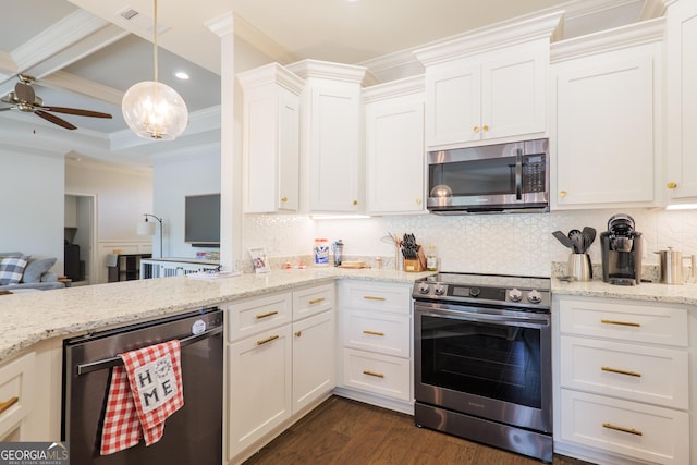 4043 Gramercy Dr, Valdosta, GA 31605 - kitchen with appliances with stainless steel finishes, crown molding, tasteful backsplash, recessed lighting, and dark wood finished floors