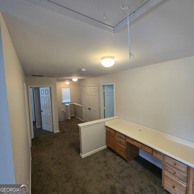 590 Dot Dr, Atlanta, GA 30349 - unfurnished office with dark colored carpet and built in desk