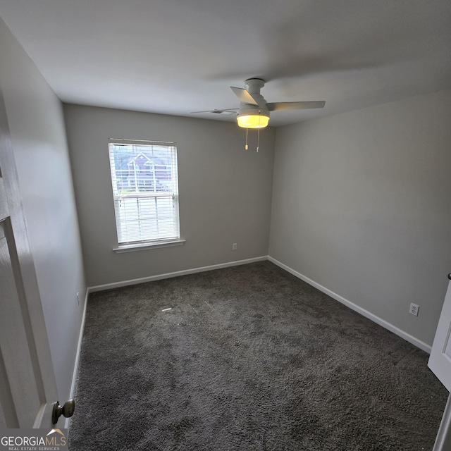 590 Dot Dr, Atlanta, GA 30349 - spare room with carpet floors, baseboards, and a ceiling fan