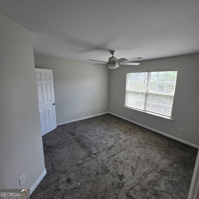 590 Dot Dr, Atlanta, GA 30349 - spare room featuring carpet floors, ceiling fan, and baseboards
