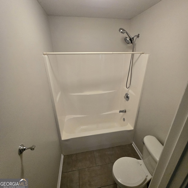 590 Dot Dr, Atlanta, GA 30349 - full bath with toilet, tile patterned flooring, baseboards, and shower / bath combination