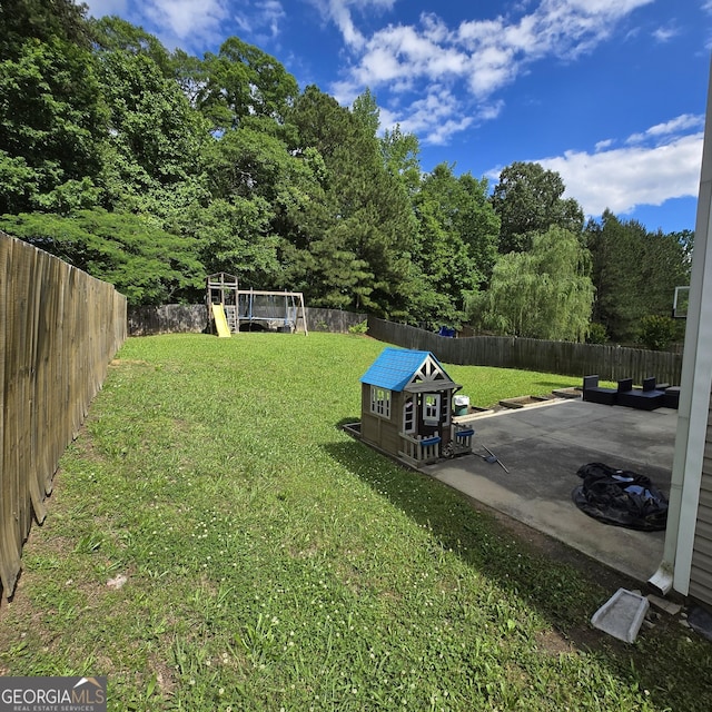 590 Dot Dr, Atlanta, GA 30349 - view of yard with a playground and a patio