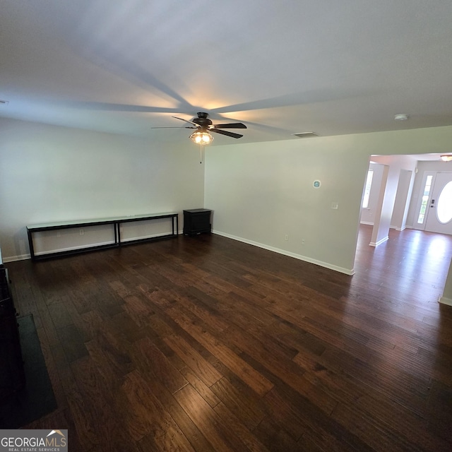 590 Dot Dr, Atlanta, GA 30349 - spare room featuring ceiling fan, dark wood finished floors, and baseboards