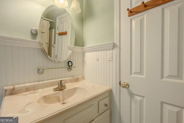 bathroom with wainscoting and vanity