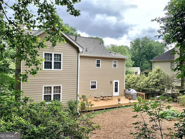 1935 Shrader Ct, Lawrenceville, GA 30044 - back of property featuring a deck and a shingled roof