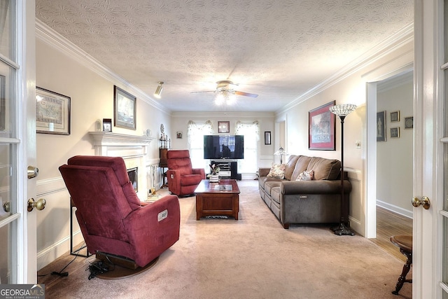 1935 Shrader Ct, Lawrenceville, GA 30044 - living room featuring ornamental molding, a fireplace, ceiling fan, carpet floors, and baseboards
