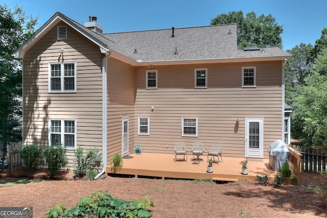 1935 Shrader Ct, Lawrenceville, GA 30044 - back of house with a deck and a chimney