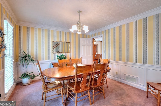1935 Shrader Ct, Lawrenceville, GA 30044 - dining area with a chandelier, ornamental molding, carpet floors, a wainscoted wall, and a decorative wall