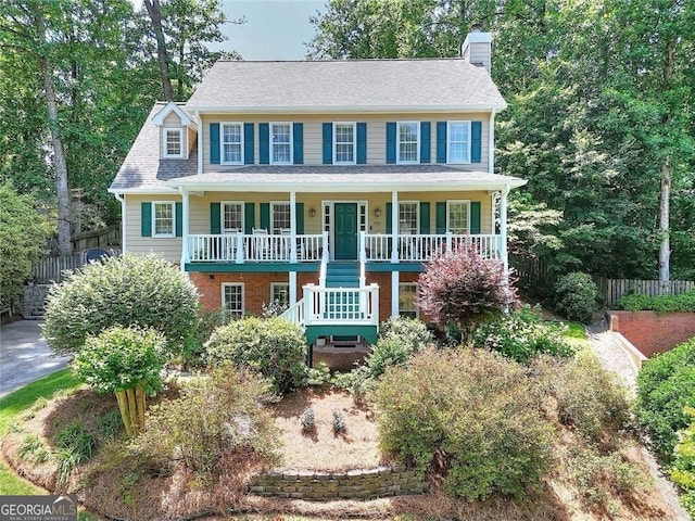 1935 Shrader Ct, Lawrenceville, GA 30044 - view of front facade featuring a porch, a chimney, and stairs