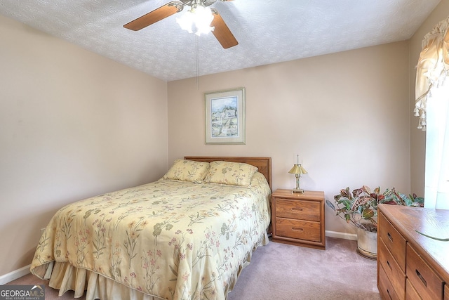 1935 Shrader Ct, Lawrenceville, GA 30044 - bedroom with light colored carpet, baseboards, ceiling fan, and a textured ceiling
