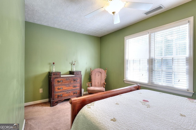 1935 Shrader Ct, Lawrenceville, GA 30044 - carpeted bedroom featuring baseboards, a ceiling fan, and a textured ceiling