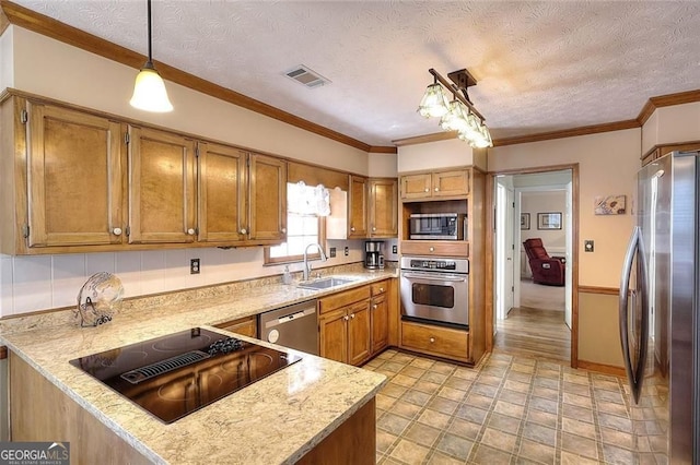1935 Shrader Ct, Lawrenceville, GA 30044 - kitchen featuring appliances with stainless steel finishes, brown cabinets, a textured ceiling, decorative light fixtures, and a peninsula