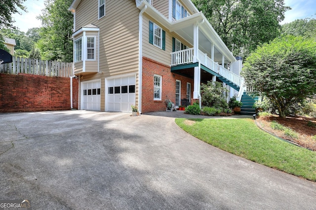 1935 Shrader Ct, Lawrenceville, GA 30044 - view of front of home with driveway, brick siding, stairs, and an attached garage