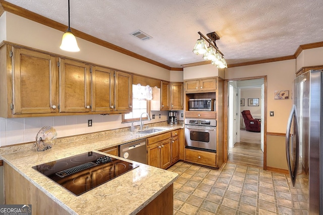 1935 Shrader Ct, Lawrenceville, GA 30044 - kitchen featuring appliances with stainless steel finishes, a sink, brown cabinets, a textured ceiling, and decorative light fixtures
