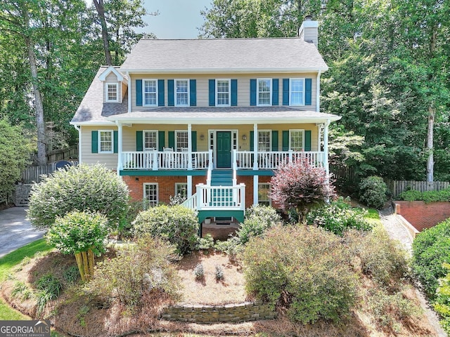 1935 Shrader Ct, Lawrenceville, GA 30044 - view of front of property featuring covered porch, a chimney, and stairway