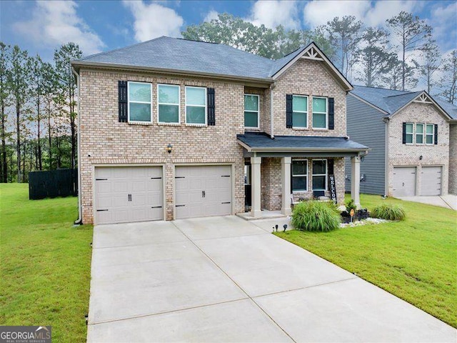 craftsman inspired home with a garage, a porch, brick siding, and driveway