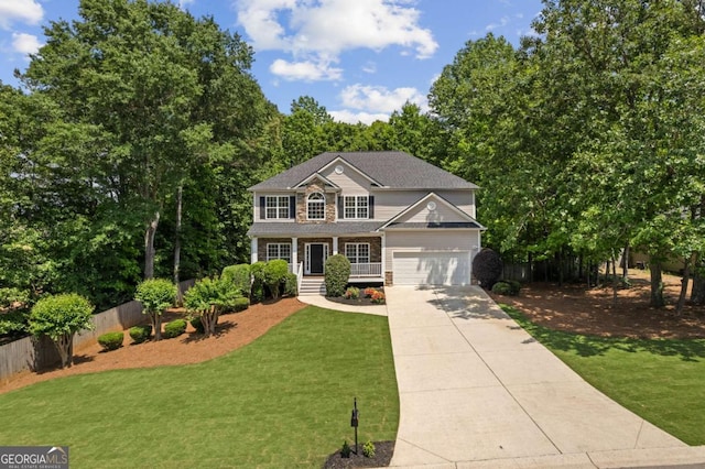 view of front of home featuring concrete driveway and covered porch