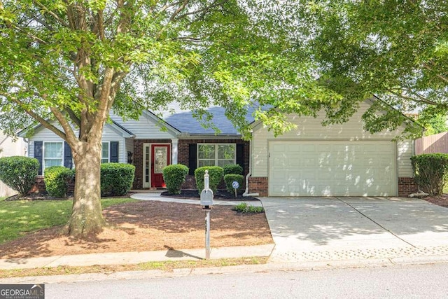 252 River Mist Cir, Jefferson, GA 30549 - view of front of house with brick siding, a garage, and driveway