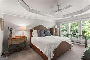 1667 Wehunt Pl SE Unit 11, Smyrna, GA 30082 - bedroom with a raised ceiling, ceiling fan, and ornamental molding