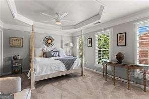 1667 Wehunt Pl SE Unit 11, Smyrna, GA 30082 - bedroom featuring crown molding, a raised ceiling, and multiple windows