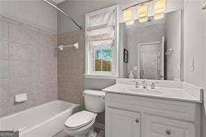 1667 Wehunt Pl SE Unit 11, Smyrna, GA 30082 - bathroom featuring toilet, vanity, and bathtub / shower combination