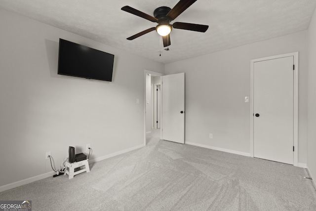 111 Northdale Pl, Lawrenceville, GA 30046 - unfurnished bedroom featuring carpet, baseboards, a textured ceiling, and a ceiling fan