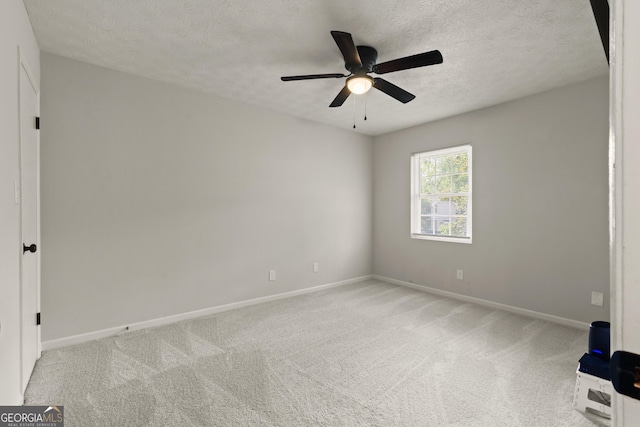 111 Northdale Pl, Lawrenceville, GA 30046 - spare room with baseboards, ceiling fan, light colored carpet, and a textured ceiling