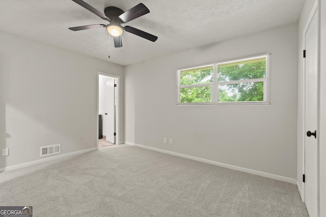 111 Northdale Pl, Lawrenceville, GA 30046 - unfurnished bedroom with baseboards, light carpet, a textured ceiling, and a ceiling fan