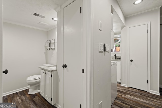111 Northdale Pl, Lawrenceville, GA 30046 - half bath with vanity, toilet, wood finished floors, ornamental molding, and recessed lighting