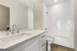 219 Howell Dr SE Unit A, Atlanta, GA 30316 - bathroom with toilet, vanity, and shower / tub combination