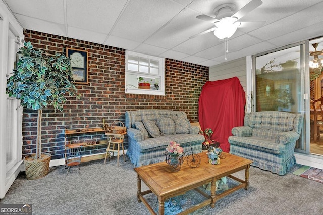 200 Dogwood Dr, Canton, GA 30114 - carpeted living area featuring a paneled ceiling, brick wall, and a ceiling fan