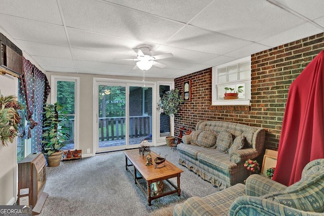 200 Dogwood Dr, Canton, GA 30114 - carpeted living area featuring brick wall, a drop ceiling, and ceiling fan