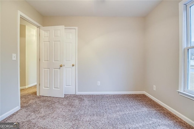 402 Hancock Ct, Woodstock, GA 30188 - spare room featuring carpet floors and baseboards