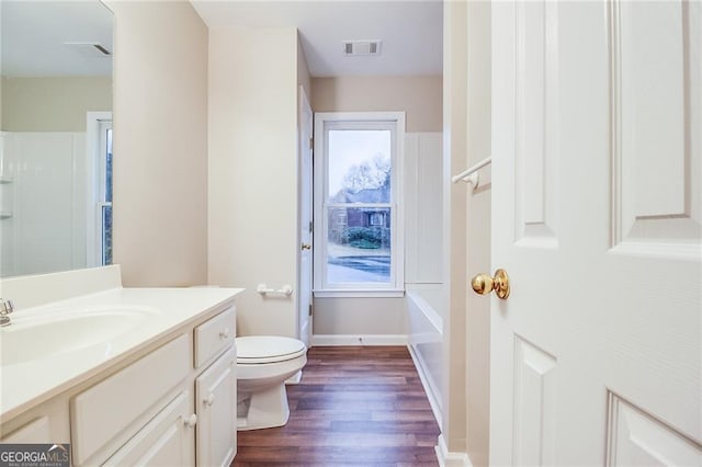 402 Hancock Ct, Woodstock, GA 30188 - bathroom with toilet, vanity, wood finished floors, a bath, and a shower