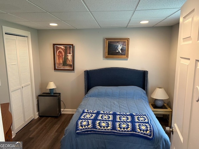402 Hancock Ct, Woodstock, GA 30188 - bedroom with wood finished floors, baseboards, a paneled ceiling, a closet, and recessed lighting