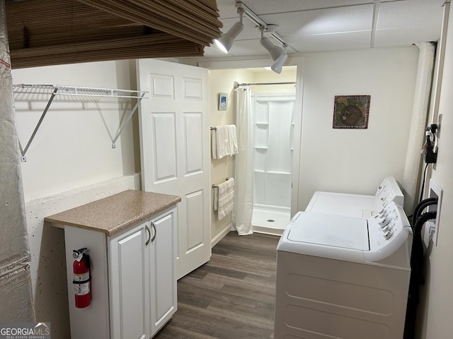 402 Hancock Ct, Woodstock, GA 30188 - laundry room with washer and clothes dryer and dark wood-type flooring