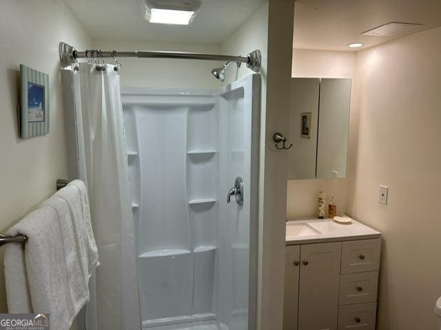 402 Hancock Ct, Woodstock, GA 30188 - full bathroom with a shower stall, vanity, and toilet