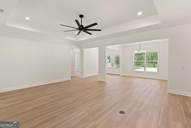 108 Branch Creek Rd, Woodbine, GA 31569 - unfurnished living room with a tray ceiling, a ceiling fan, light wood-style floors, a chandelier, and crown molding