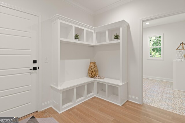 108 Branch Creek Rd, Woodbine, GA 31569 - mudroom with baseboards, light wood-style floors, and ornamental molding