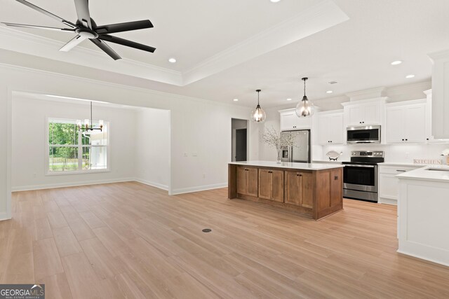 108 Branch Creek Rd, Woodbine, GA 31569 - kitchen with stainless steel appliances, a kitchen island, a chandelier, light wood-type flooring, and crown molding