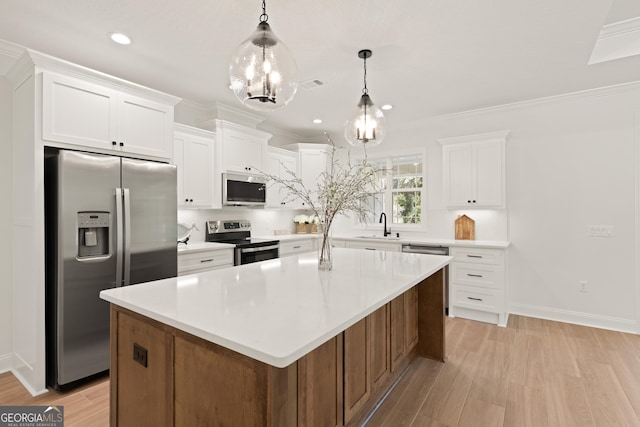 108 Branch Creek Rd, Woodbine, GA 31569 - kitchen with appliances with stainless steel finishes, a sink, light wood-style floors, white cabinetry, and recessed lighting