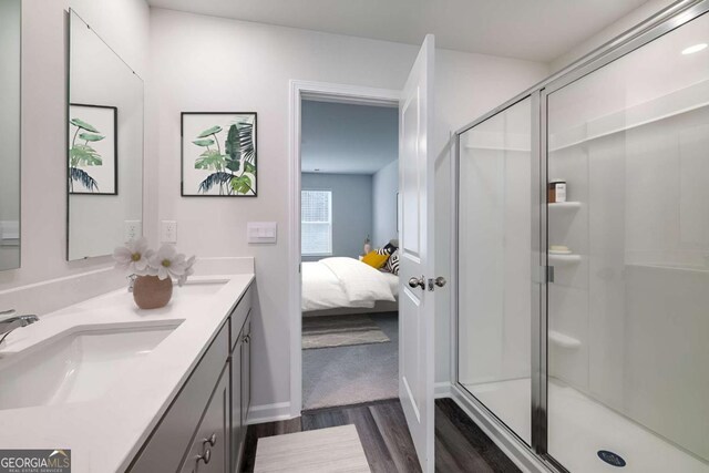 201 Ellie Way, Savannah, GA 31419 - full bath featuring wood finished floors, double vanity, a shower stall, and connected bathroom