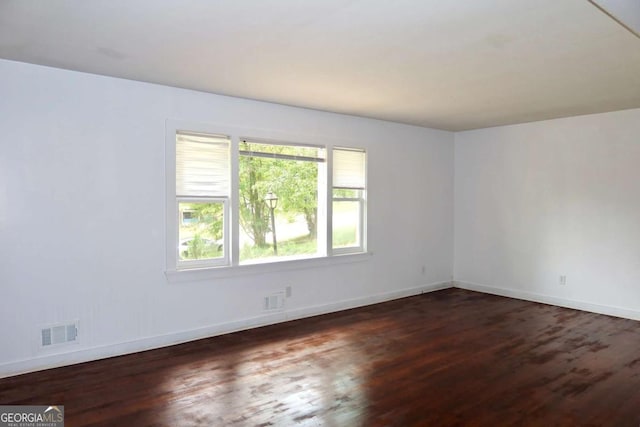 579 Kenridge Cir, Stone Mountain, GA 30083 - spare room featuring wood finished floors and baseboards