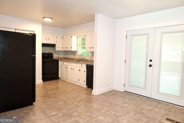 579 Kenridge Cir, Stone Mountain, GA 30083 - kitchen with black appliances, french doors, a sink, and under cabinet range hood