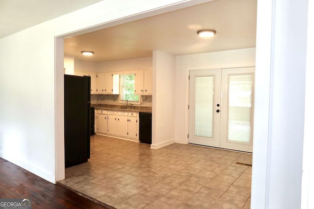579 Kenridge Cir, Stone Mountain, GA 30083 - kitchen featuring black appliances, french doors, a sink, and baseboards