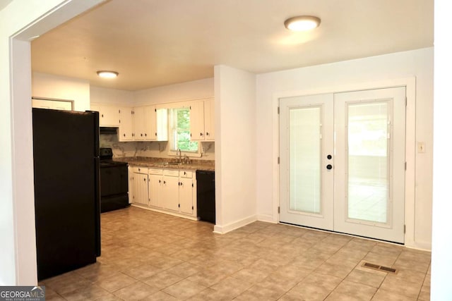 579 Kenridge Cir, Stone Mountain, GA 30083 - kitchen with black appliances, french doors, a sink, and white cabinets