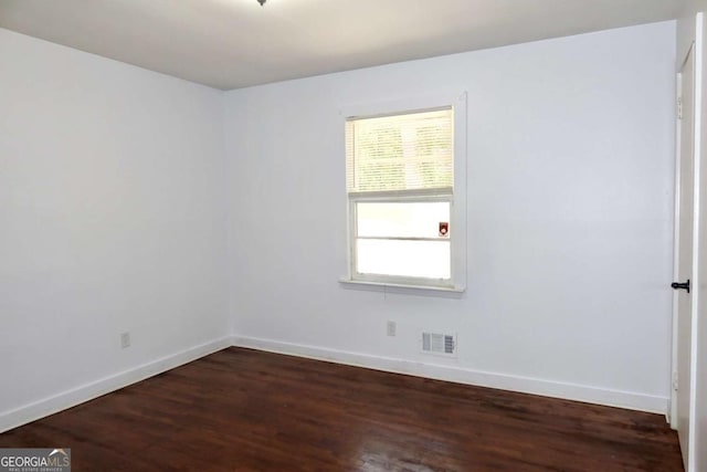 579 Kenridge Cir, Stone Mountain, GA 30083 - spare room with wood finished floors and baseboards